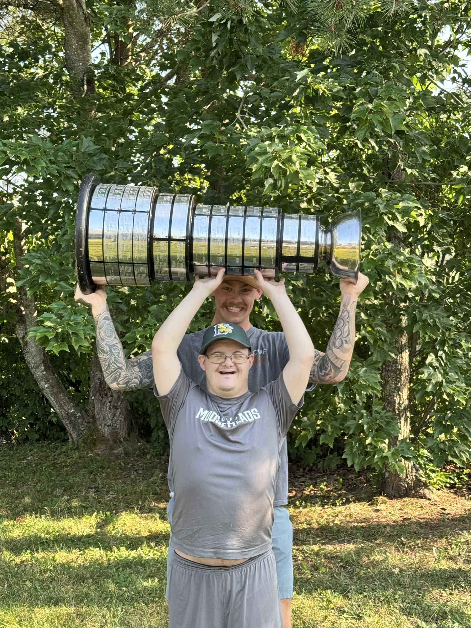Tyler celebrating with a championship cup