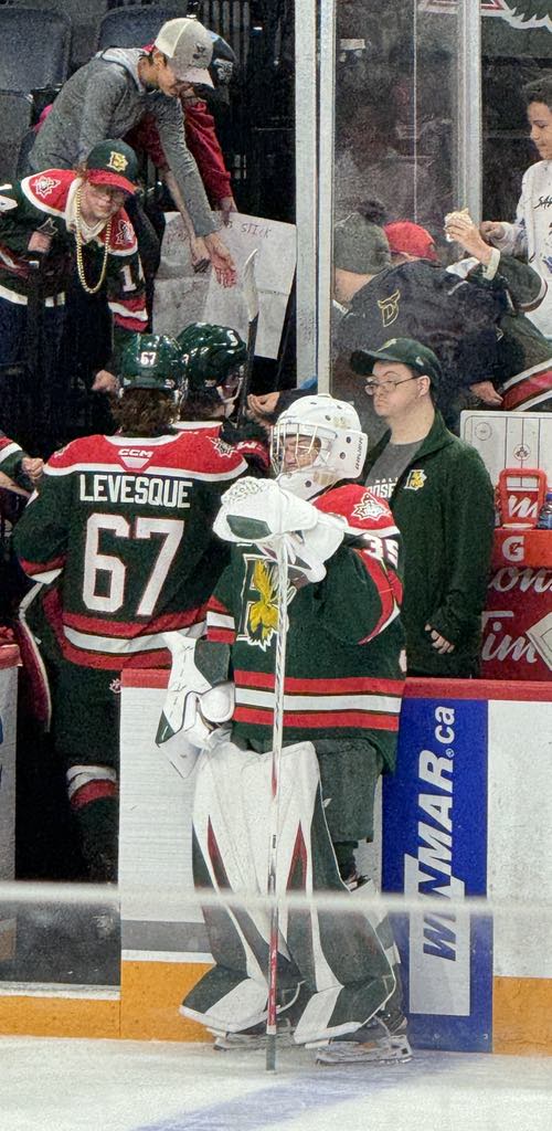 Tyler supporting a goalie at the rink